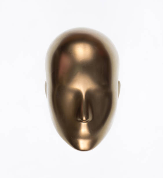 golden mannequin head isolated on white background