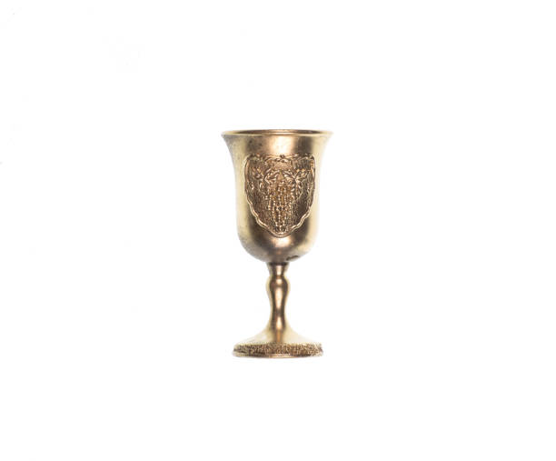istock golden royal wineglass isolated on white background 1214493439
