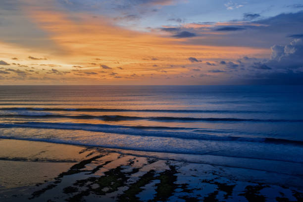 istock sunset and the sea with hut 1214493896