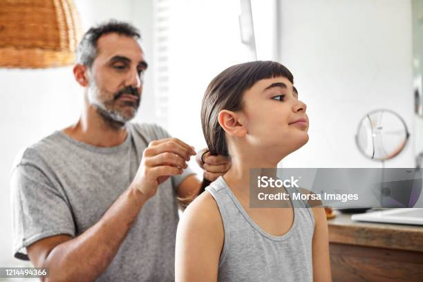 Gay Man Is Tying Daughters Hair In Bathroom Stock Photo - Download Image Now - Father, Daughter, Gay Person