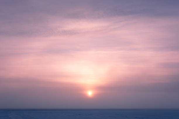 istock Sun through fog at lake winter morning 1214497123
