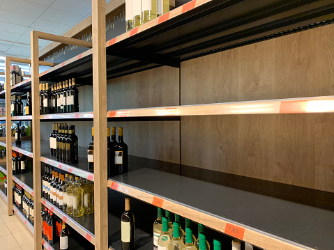 Empty wine and ather alcoholic beverages shelves at supermarket during the 2020 COVID-19 (Coronavirus) outbreak