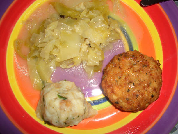 dumplings with sauerkraut on a plate in the kitchen
