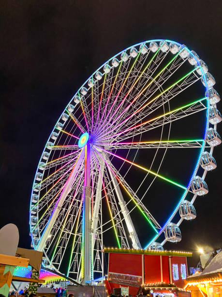 istock colorful ferris wheel at night. Amusement park 1214499609