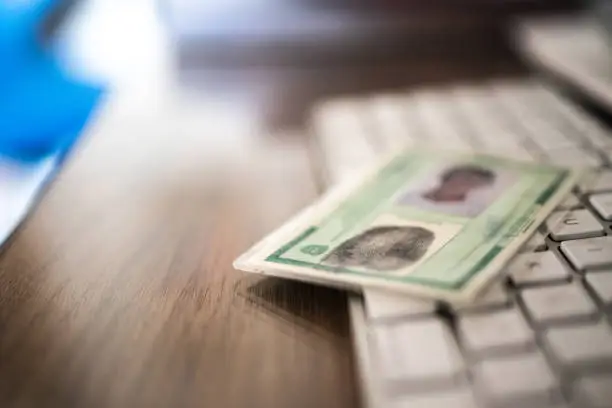 Photo of Brazilian identity at desk - registro geral - RG