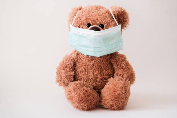 istock Teddy bear wearing protective medical mask. 1214501345