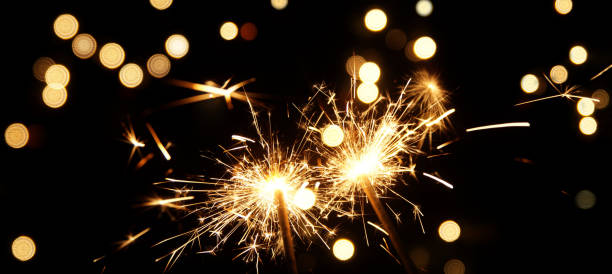 istock Panoramic light effect. burning sparkler firework. Happy new year and Merry christmas concept. Happy holidays. Abstract blurred of Sparklers for celebration. 1214501554