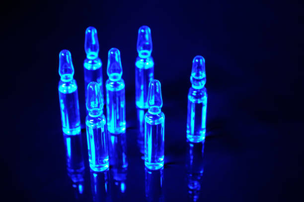 istock Vaccine against a virus on a black background. 1214503122