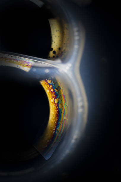istock Soap bubbles patterns and designs formed by washing up liquid and liquid soaps. 1214507486