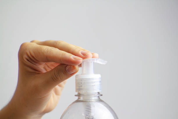 istock Washing hand with antibacterial alcohol antiseptic gel in hand on white isolate 1214509148