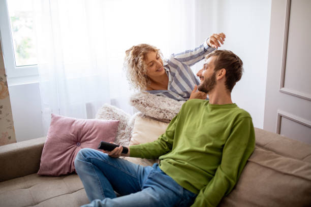 istock Happy young couple relaxing at home 1214509883