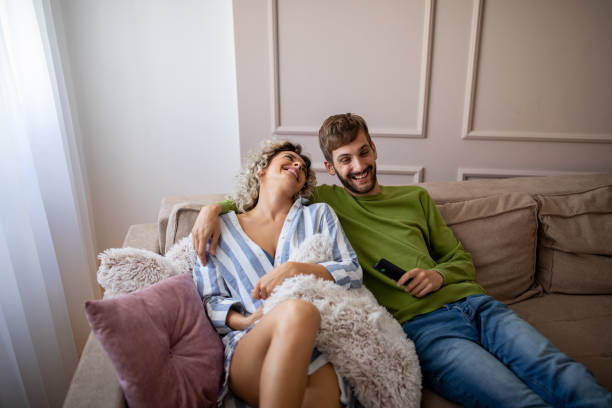 istock Happy young couple relaxing at home 1214510098
