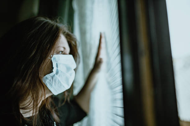 istock woman in isolation at home for virus outbreak 1214510183
