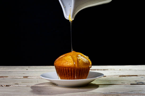istock sweet cupcakes with honey and syrup 1214514082
