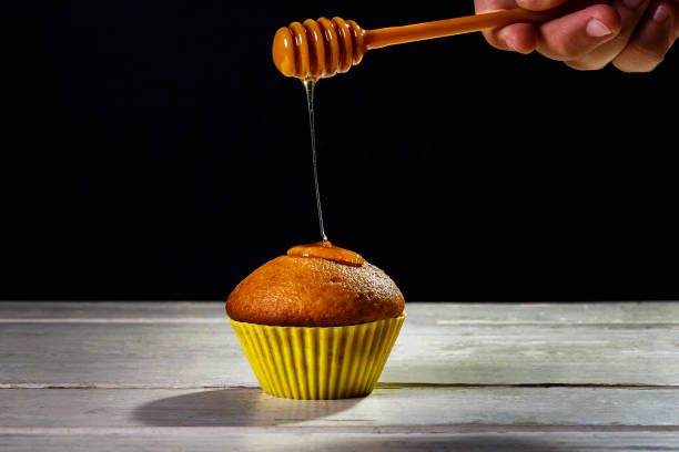 istock sweet cupcakes with honey and syrup 1214514130