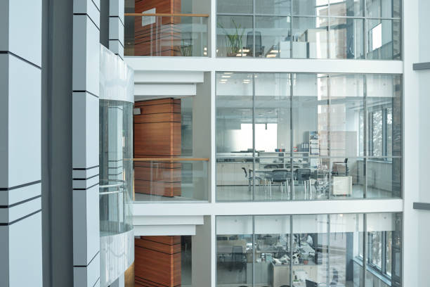 istock Several floors inside large business center with balconies, windows and offices 1214517042
