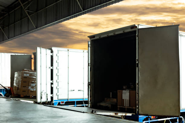 istock Truck docking load cargo shipment goods at warehouse, Road freight industry delivery logistics and transport 1214518641