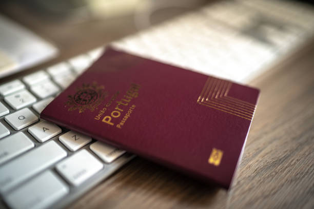 istock Portuguese passport at desk 1214519103