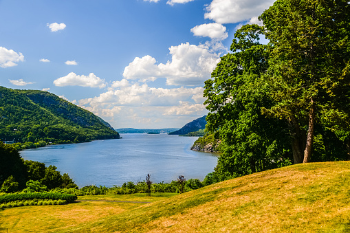 A view of the Lower Hudson River at West Point, New York about 50 miles north of New York City with the Bear Mountains at both sides of the river.