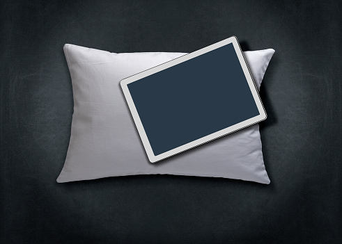 Tablet PC On white pillow.  Home Office, E- Learning concept.