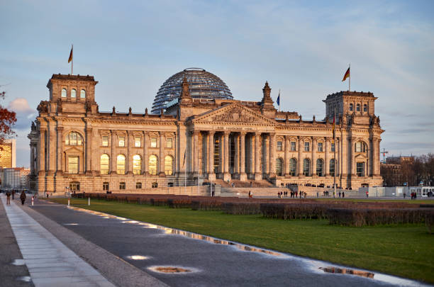 istock The Reichstag building during sunset in Berlin, Germany with reflection 1214522315