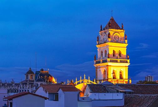 Cityscape of Sucre city with the Metropolitan Cathedral tower at night, Bolivia.