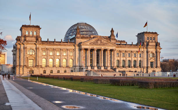 istock The Reichstag building during sunset in Berlin, Germany with reflection 1214522749