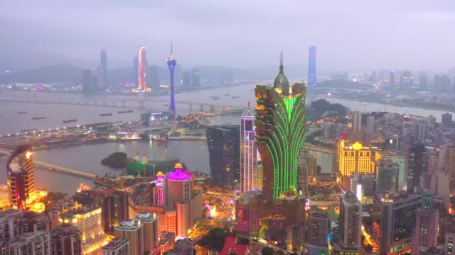 4k footage of Aerial view of Macau over the city during night time. Travel destination and tourist attractions