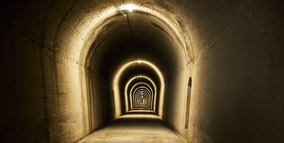lighted and dingy tunnel
