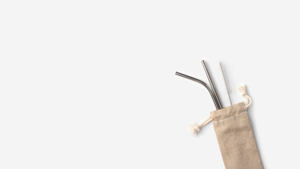 istock Ecological stainless steel straws in a linen case on a white background. Zero waste, plastic free, eco friendly concept 1214526193