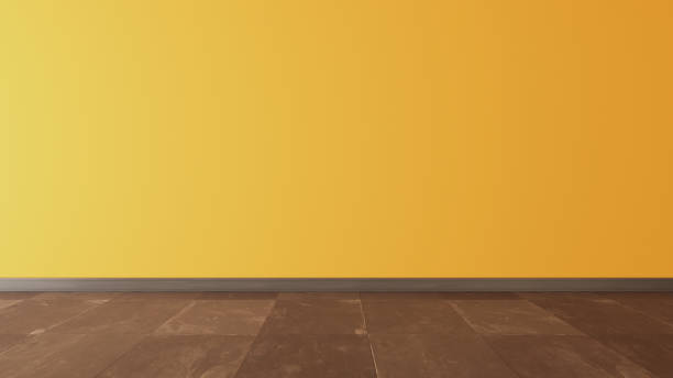 istock yellow wall and black stone floor under sun light 3D rendering 1214528263