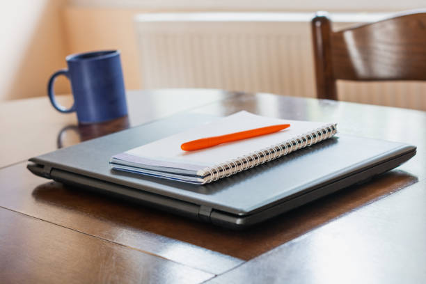 istock Documents on office table with pen and laptop as work space business concept 1214528970
