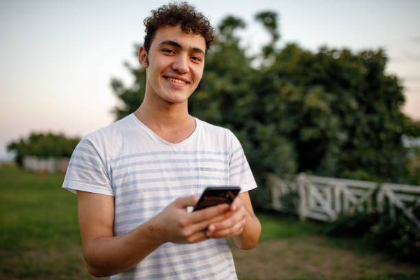 istock Teenager boy texting message 1214532248