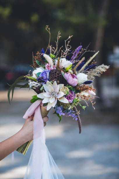 istock The bride and the flowers in her hand 1214532527