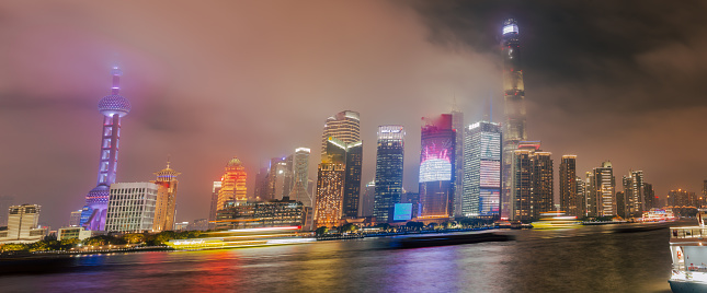This pic shows illuminated Shanghai, China city skyline on the Huangpu River.The pic is taken at night time in shanghai in november 2019.