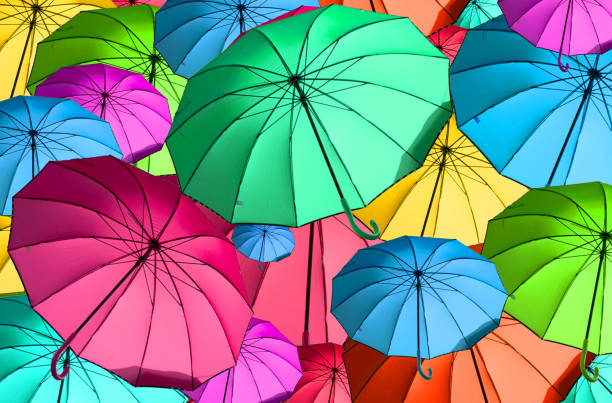 istock 3d,colorful umbrellas fly with the wind 1214535089