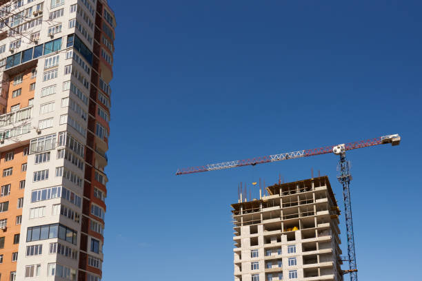 istock Construction site with cranes and new building on sky background 1214535600