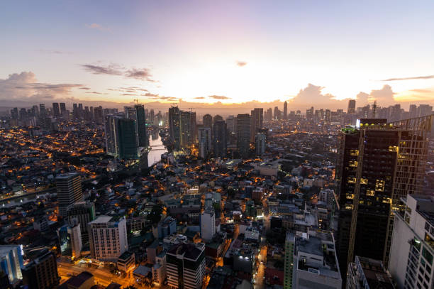 istock Manila city view at night from a skyscraper while the sun rises 1214535656