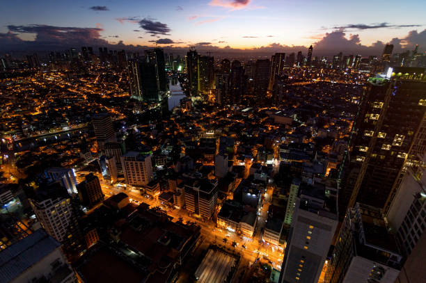 istock Manila city view at night from a skyscraper while the sun rises 1214535660