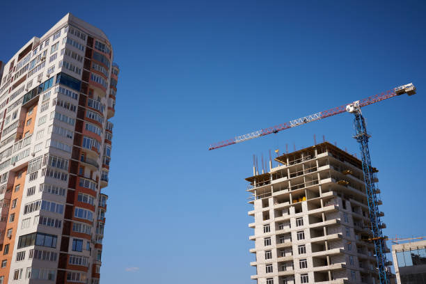 istock Construction site with cranes and new building on sky background 1214535777