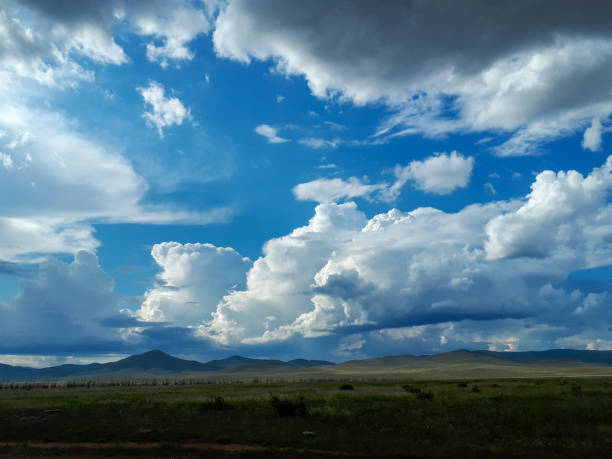 istock Photograph summer blue sky clouds green hills and mountains 1214538358