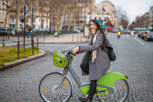 istock Asian woman using e-bicycle in the city 1214541228