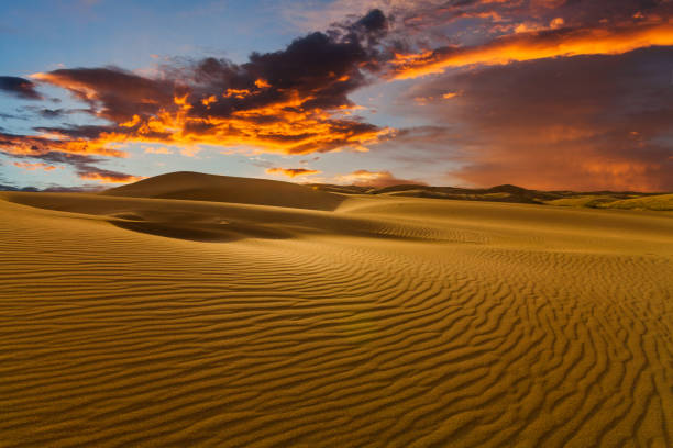 istock Deserts and Sand Dunes Landscape at sunset 1214541650