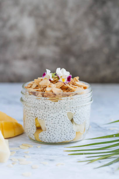 istock Chia pudding with mango, pineapple, almond nuts and oats 1214545030