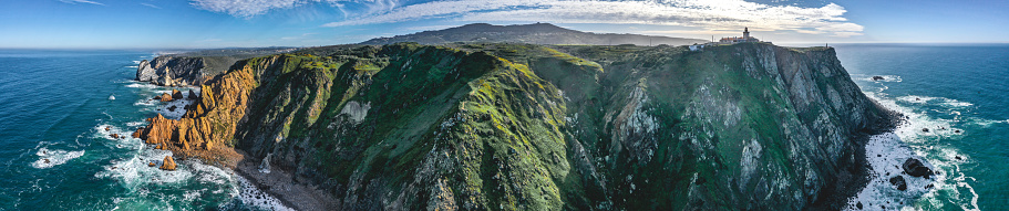 Cabo da Roca or Cape Roca is a cape which forms the westernmost point of the Sintra Mountain Range, of mainland Portugal