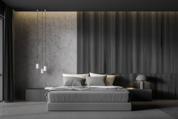 istock Concrete and dark wooden master bedroom interior 1214545363