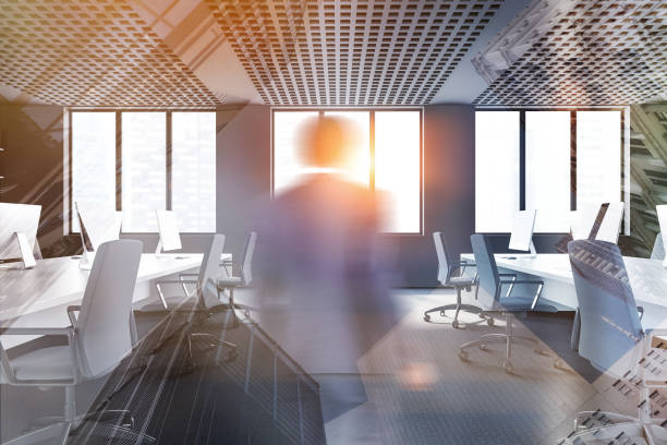 istock African man entering gray open space office 1214545375
