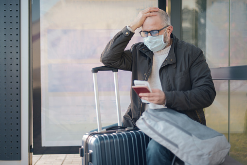 Mature adult man wearing medical mask