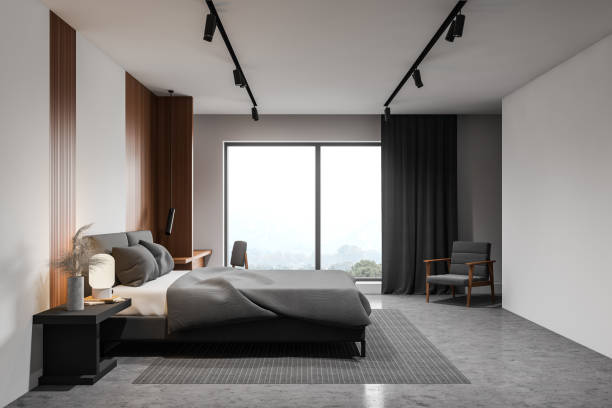 istock White master bedroom with armchair, side view 1214546411