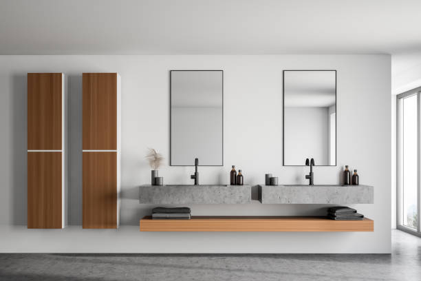 istock Double sink and cabinets in white bathroom 1214547975